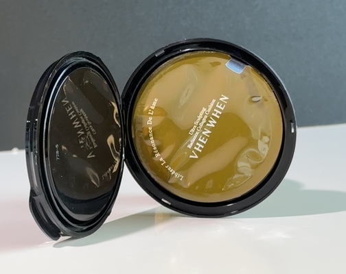 Couvercle de film compact thermiquement étanche pour poudre cosmétique pressée en poudre