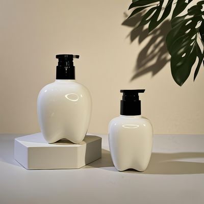 Bouteille en plastique en forme de dent de 100 à 250 ml avec pompe à pression pour le lavage des mains, lotion capillaire, désinfectant pour les mains, logo personnalisable